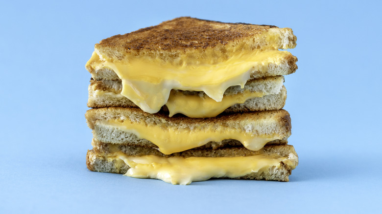A stack of halved grilled cheese sandwiches