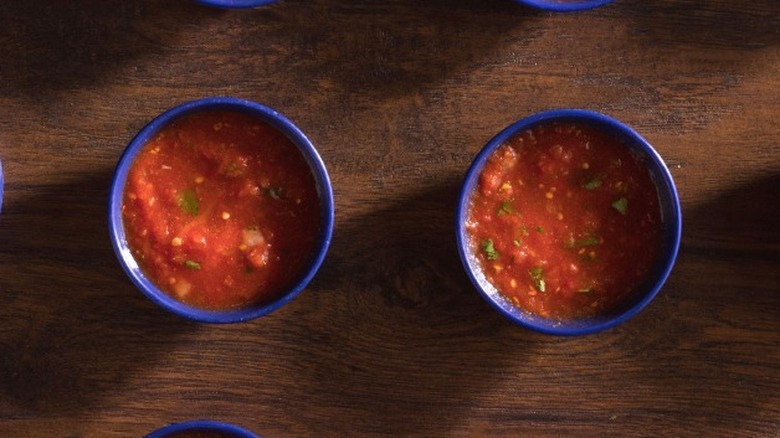 Close-ups of On The Border salsas in small blue bowls