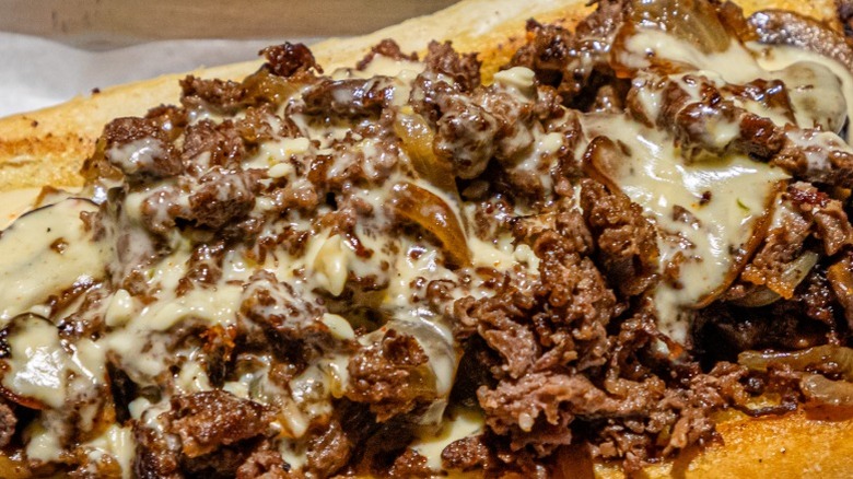 shredded steak, onions, and melted cheese
