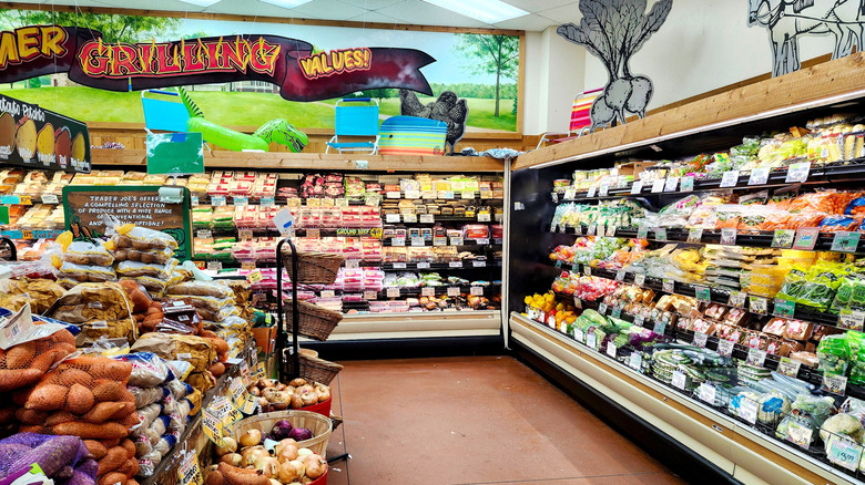 The interior of a Trader Joe's store, including produce and fridges