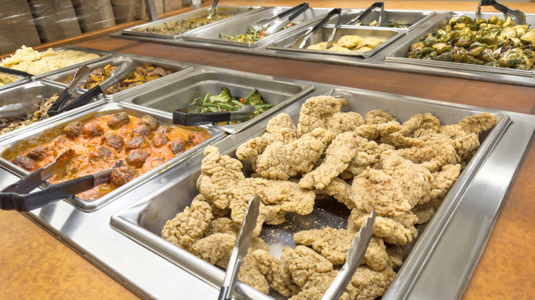 A buffet setup with multiple offerings of food