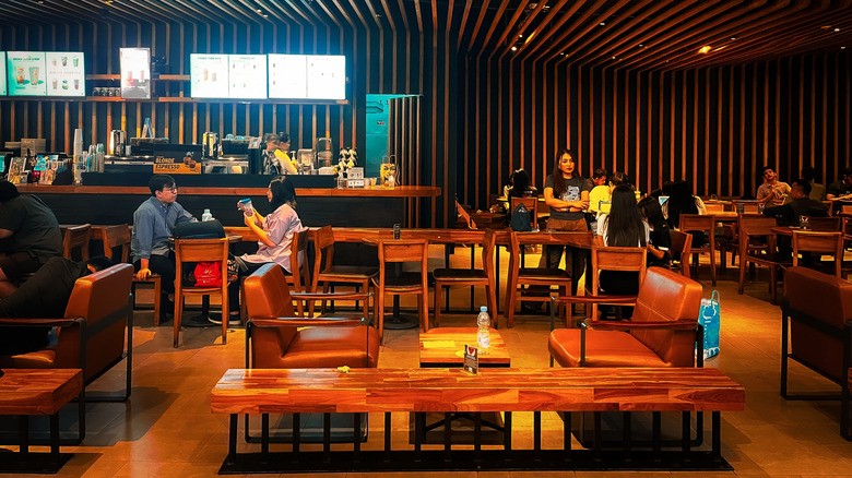 The interior of a Starbucks location with ample seating.