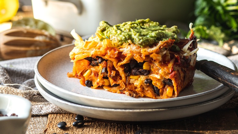 vegan enchilada casserole on a white plate