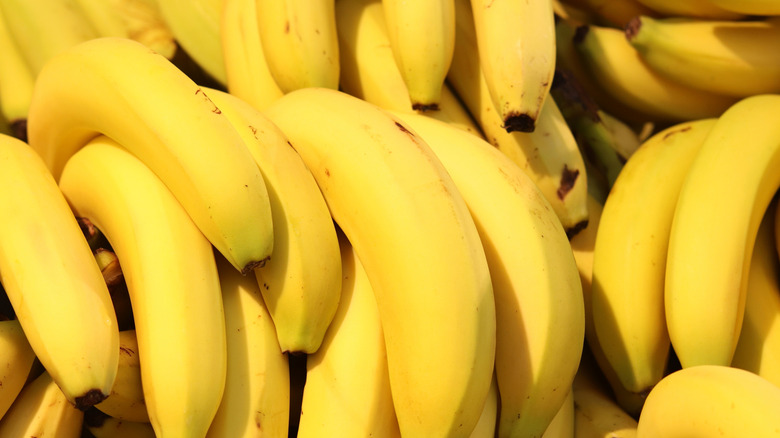 A close-up of bunches of ripe bananas for sale