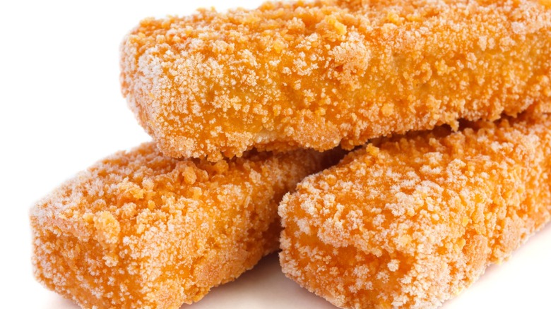 Close-up of frozen fish sticks isolated on a white background