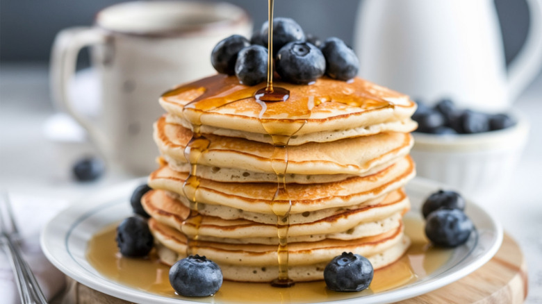 stack of pancakes garnished with blueberries