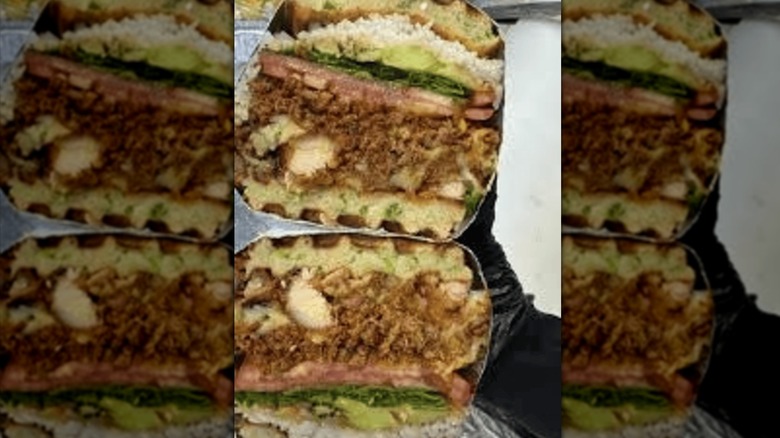 Customized Philly cheesesteak sandwich sliced in half