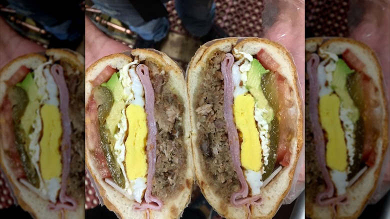 Close up of a torta Cubana sandwich sliced in half