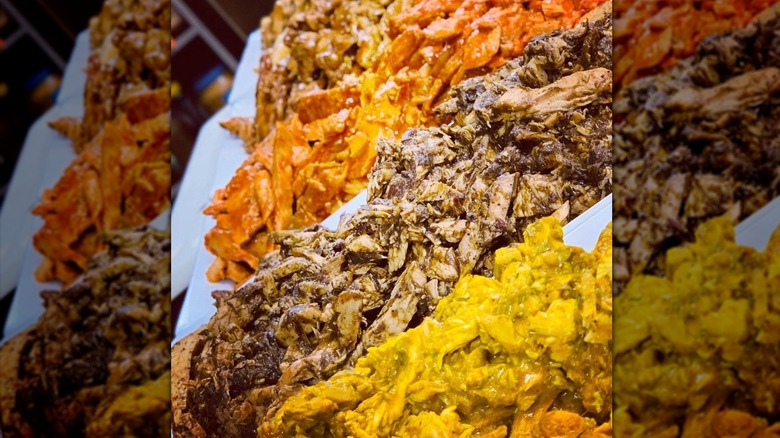 Close up of jerk chicken and other spiced chopped meats