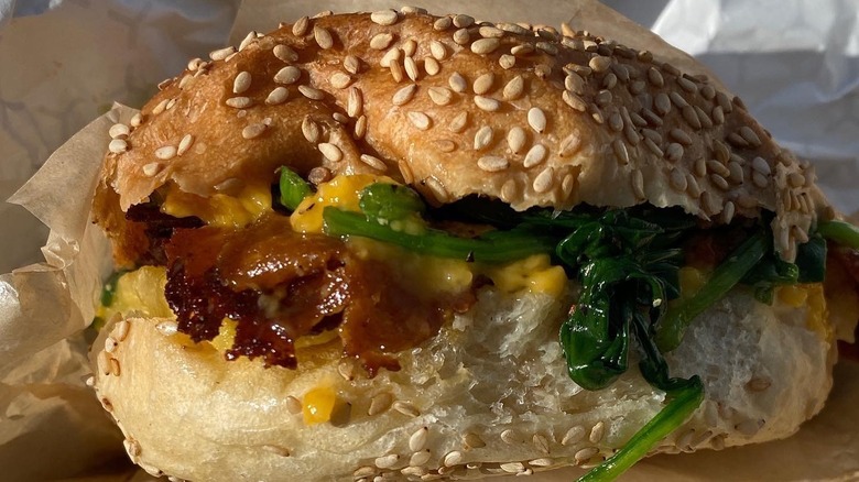 Close up of a vegan bacon, egg, and cheese sandwich