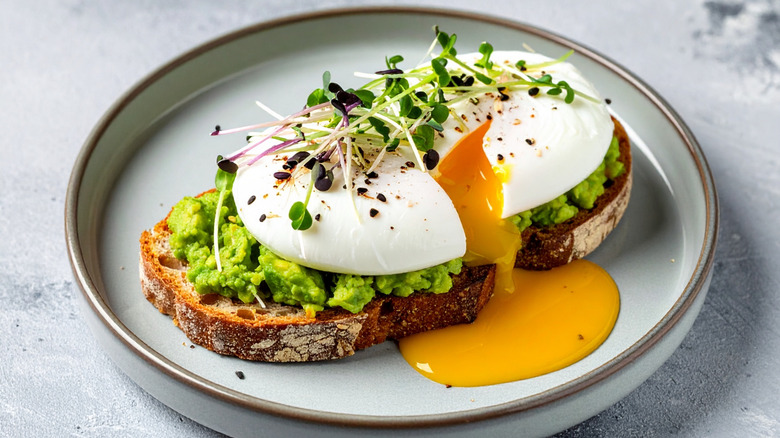 Artisanal Avocado Toast with Poached Eggs on Sourdough Bread