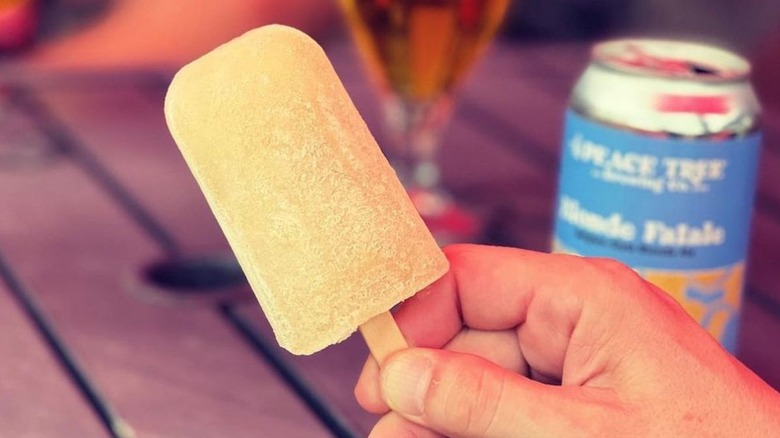 hand holding beer popsicle