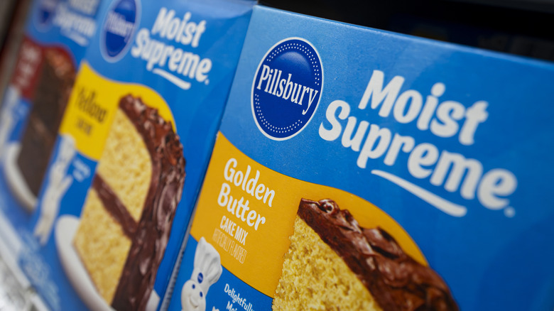 Boxes of Pillsbury Golden Butter Moist Supreme cake mix on a store shelf