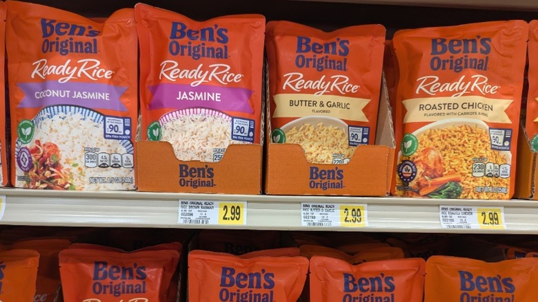 Bags of Ben's Original ready rice pouches on a supermarket shelf.