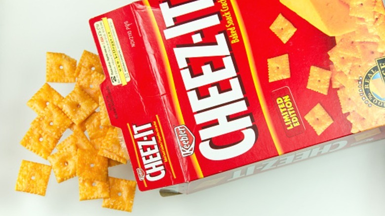 A box of Cheez-It on its side, with contents spilling out.