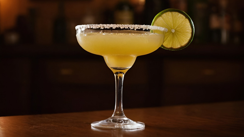 Margarita with salted rim and lime wheel