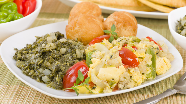 A plate of ackee and saltfish with scotch bonnets