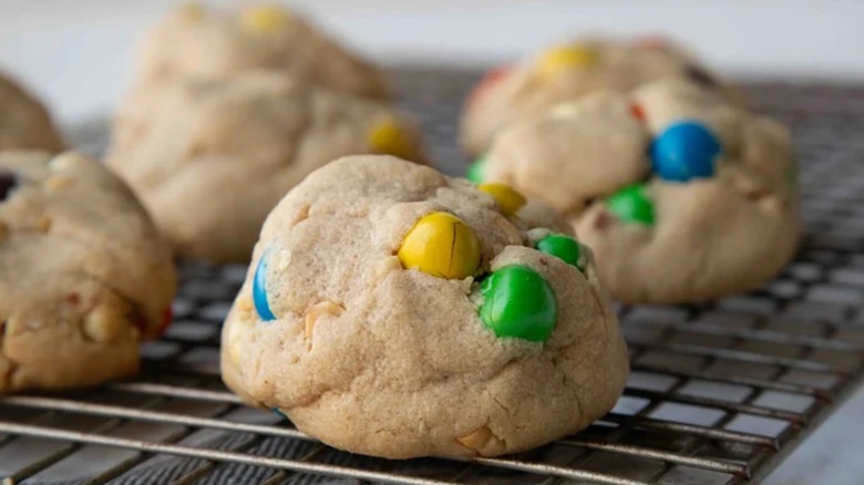 Giant M&M's cookies on a cooling rack