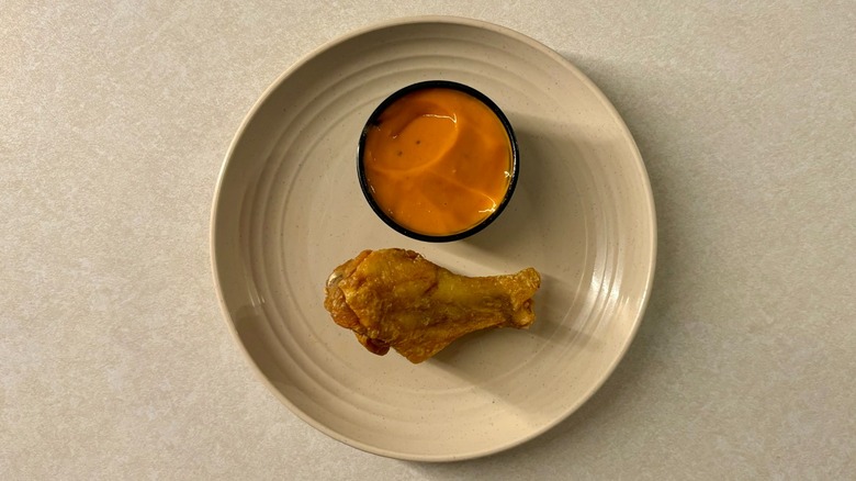 Buffalo Wild Wings Spicy Garlic sauce and wing on plate