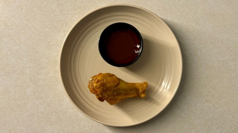 Buffalo Wild Wings Mango Habanero sauce and wing on plate