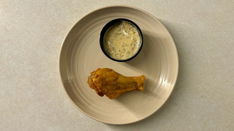 Buffalo Wild Wings Parmesan Garlic sauce and wing on plate