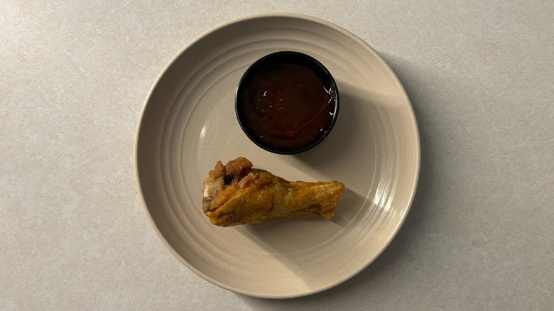 Buffalo Wild Wings Orange Chicken sauce and wing on plate