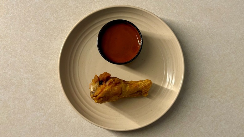 Buffalo Wild Wing Nashville Hot sauce and wing on plate