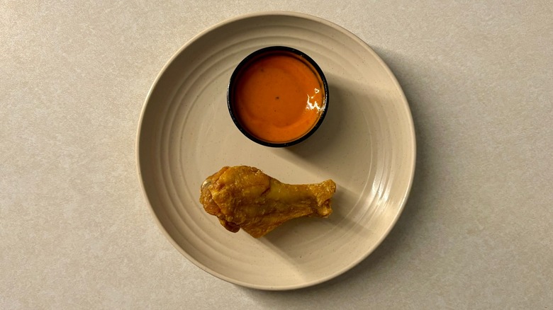 Buffalo Wild Wing Original Buffalo sauce and wing on plate