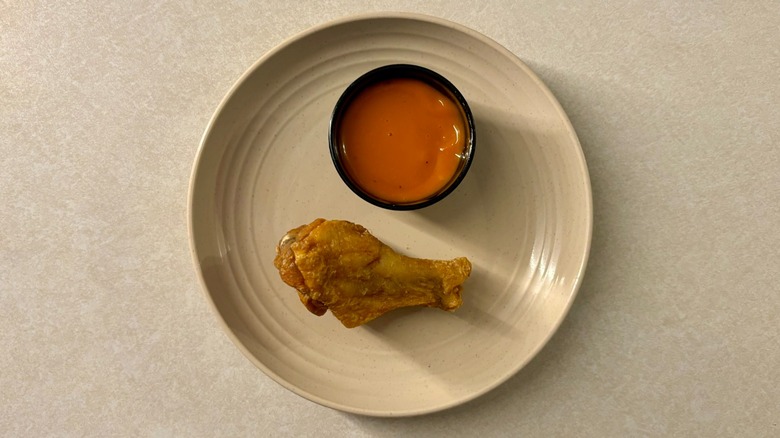 Buffalo Wild Wings Medium sauce and wing on plate
