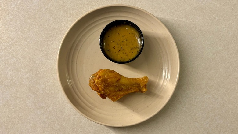 Buffalo Wild Wing Lemon Pepper sauce and wing on plate