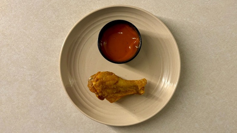 Buffalo Wild Wings Golden Fire sauce and wing on plate
