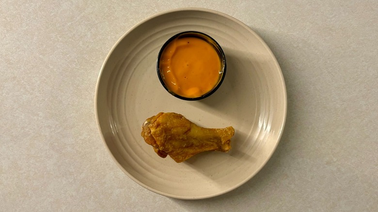 Buffalo Wild Wings Mild sauce and wing on plate