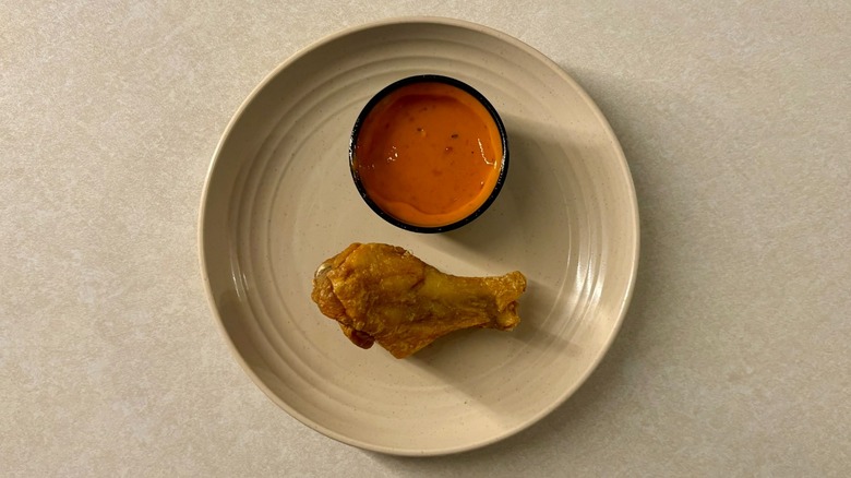 Buffalo Wild Wings Wild sauce and wing on plate