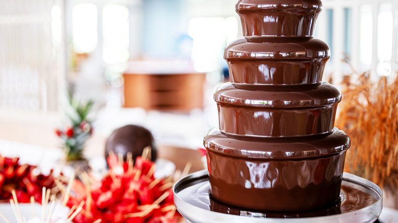 A chocolate fountain at a buffet.