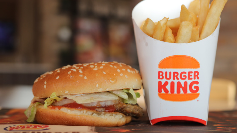 Whopper Junior and a container of fries with the Burger King logo