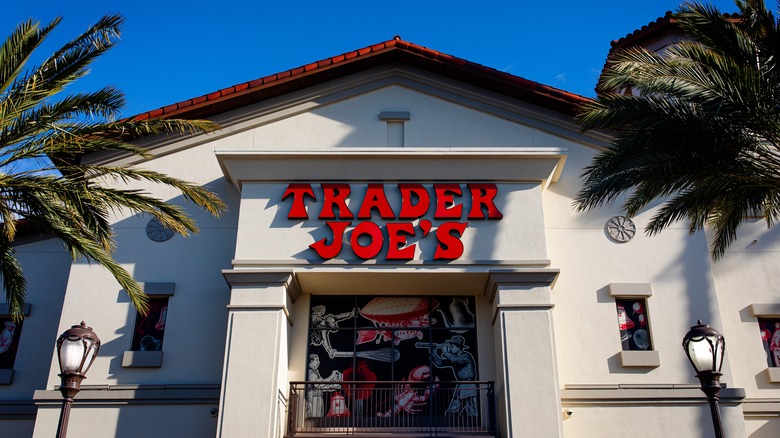 Trader Joe's storefront with palm trees and lanterns on each side