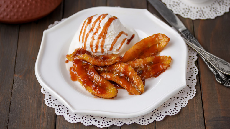 caramelized bananas on plate with vanilla ice cream