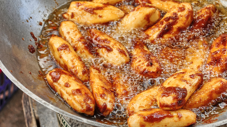 banana slices caramelizing in saucepan with sugar
