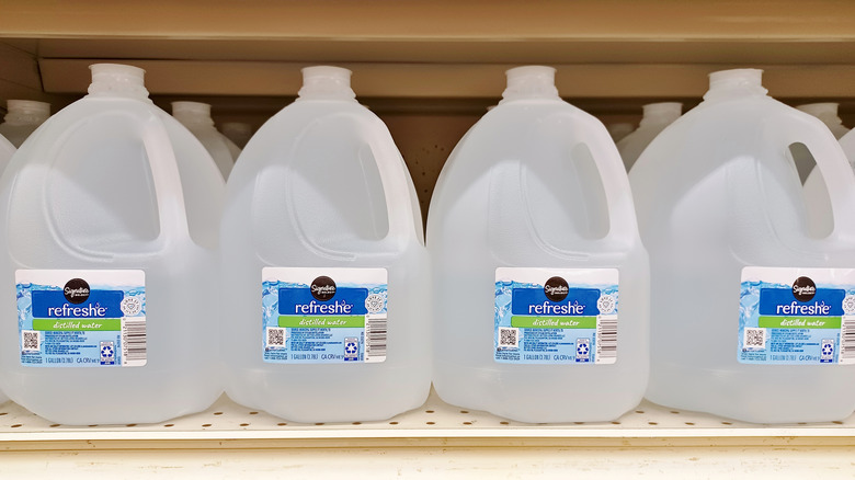 distilled water jugs on grocery store shelf