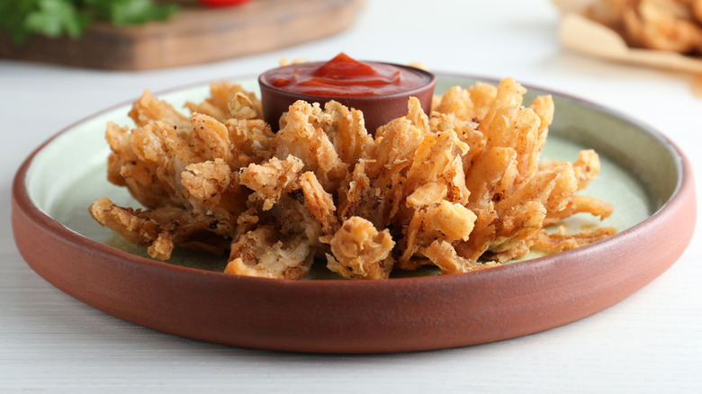 Bloomin' Onion on a plate with ketchup