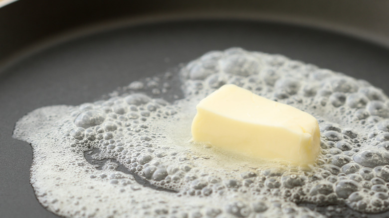 Butter melting in a hot pan