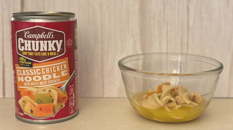 Campbell's Chunky Classic Canned Chicken Noodle Soup can with soup in bowl