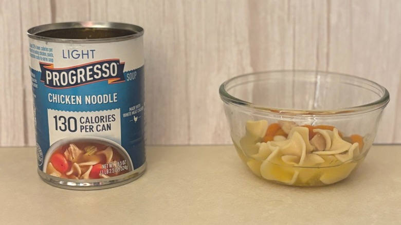 Progresso Light Canned Chicken Noodle Soup can and soup in bowl