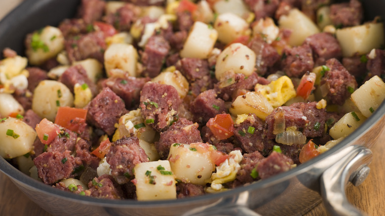 close-up of corned beef hash in stainless steel cookware