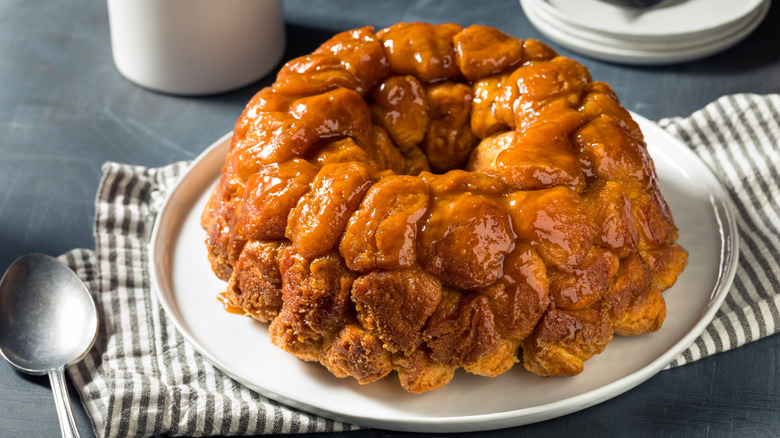 A plate of pull-apart monkey bread with caramel sauce