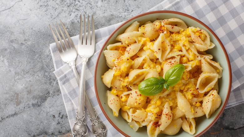 Corn mixed into macaroni and cheese