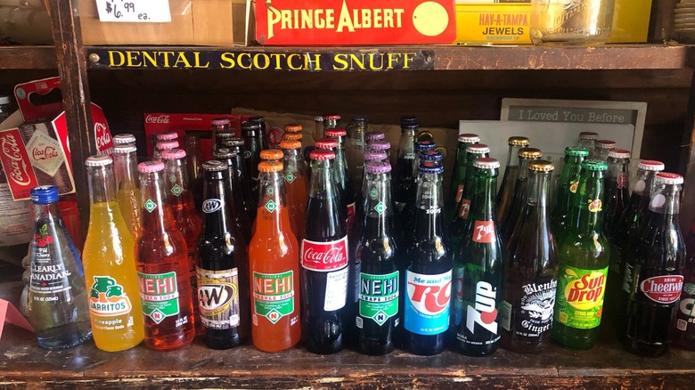 Various old-fashioned glass bottle sodas on shelf at Priddy's General Store.