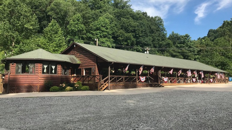 Exterior of Trust General Store & Cafe, with American flags hanging on the front porch.