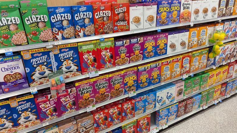 Boxes of breakfast cereal in a grocery store aisle