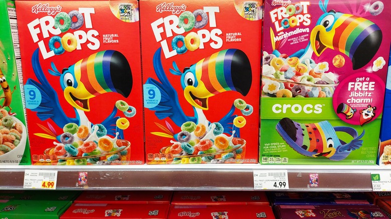 Boxes of Kellogg's Fruit Loops, Fruit Loops with Marshmallows, and Apple Jacks on a supermarket shelf